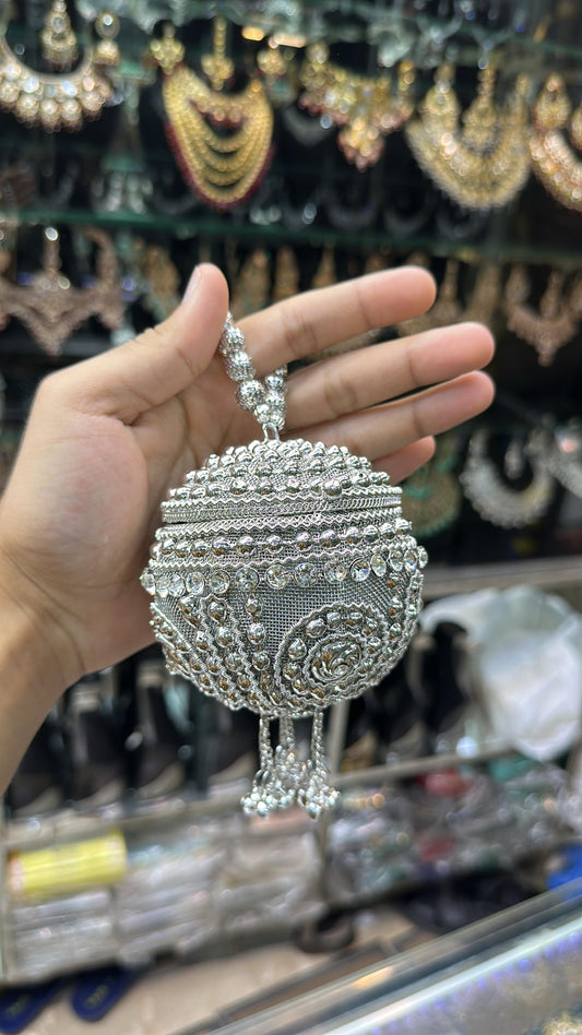 Round silver clutch
