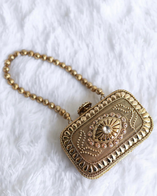 Golden clutch with chain hanging