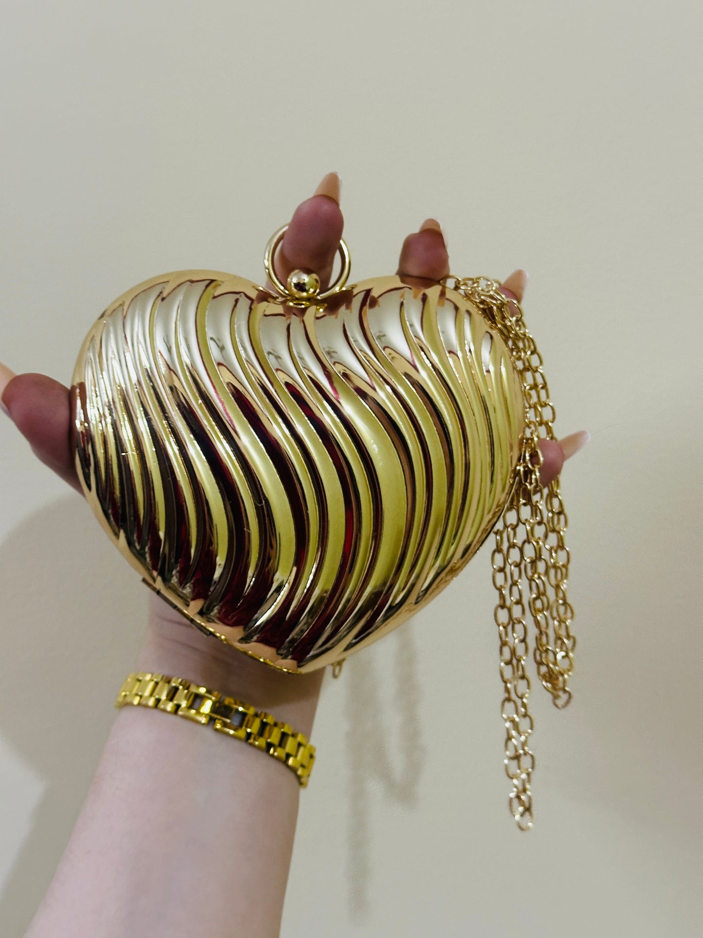 Heart shape metal clutch premium quality 💯 golden colour
