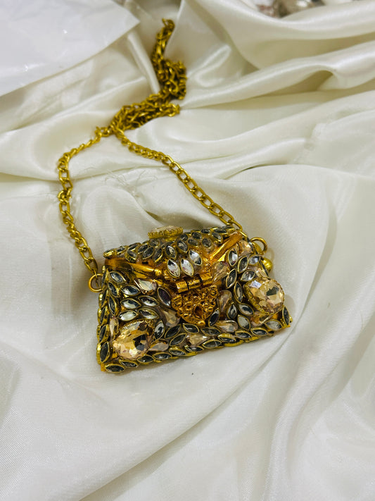 Golden coin clutch kundan