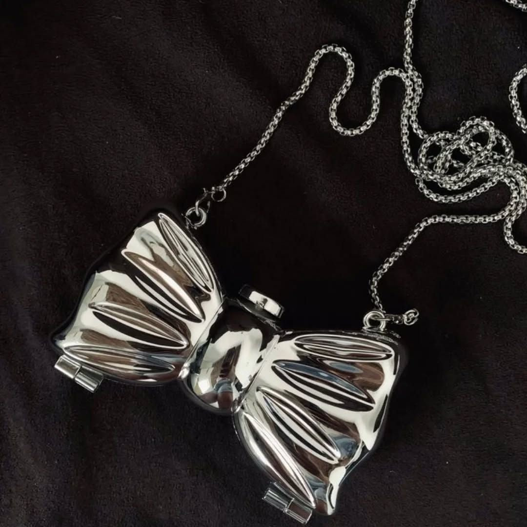 SILVER BOW IN METAL