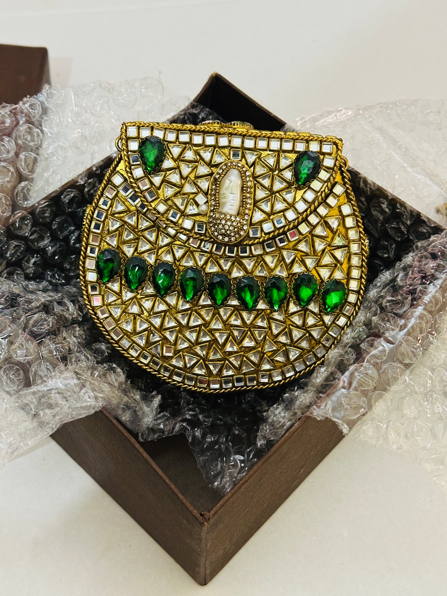 Green stones kundan clutch