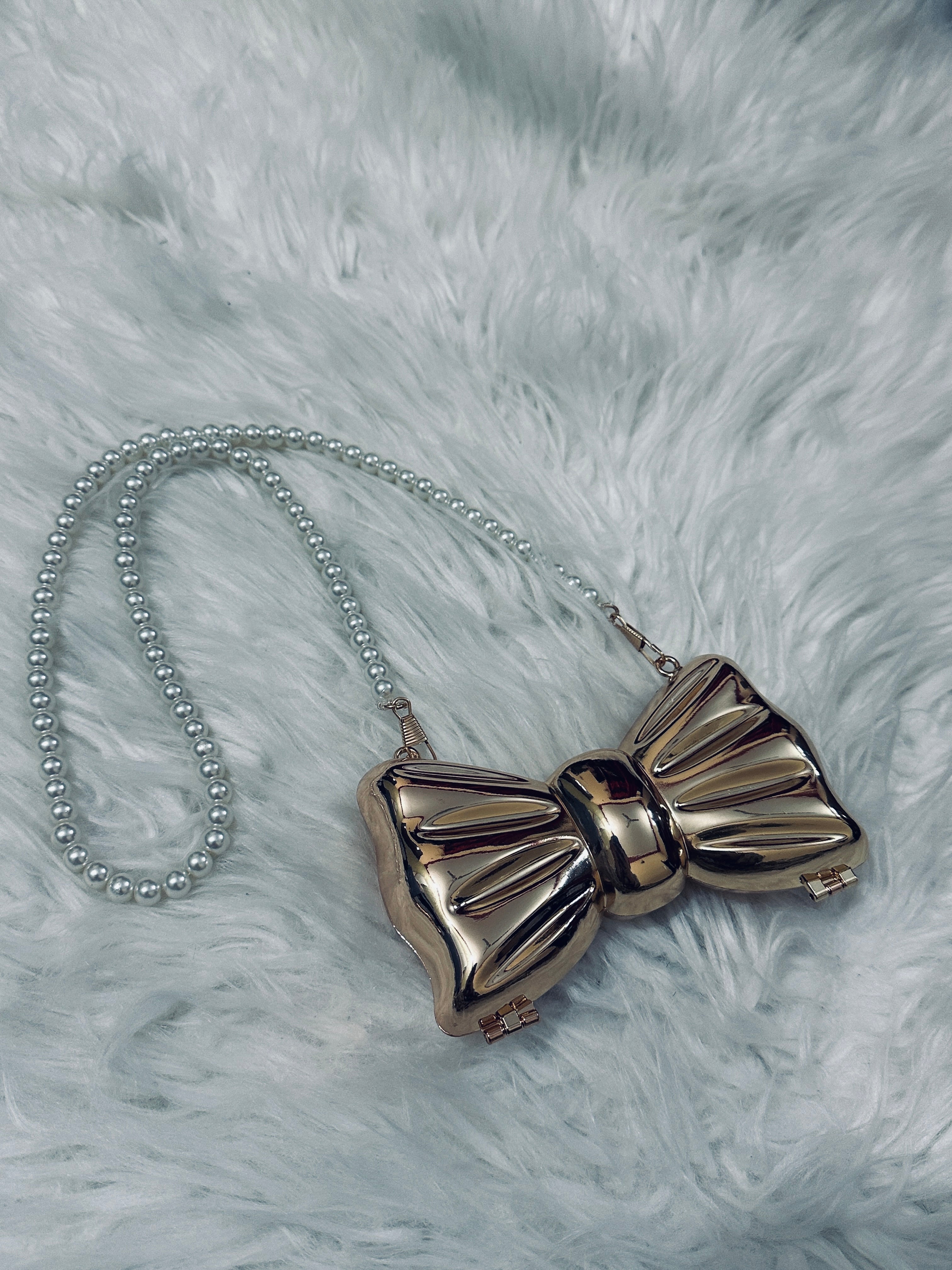 Bow pearl clutch metalic